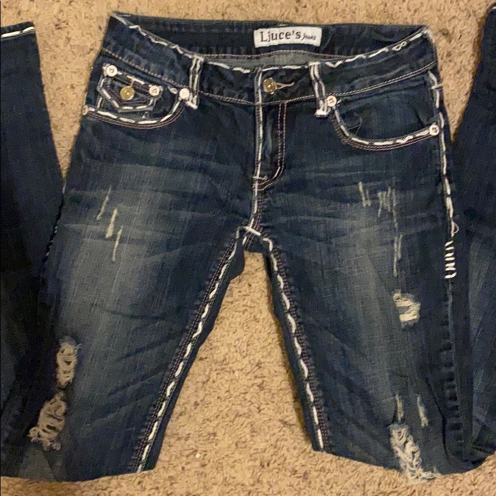 Boot cut, dark washed jeans by Liuce’s jeans.